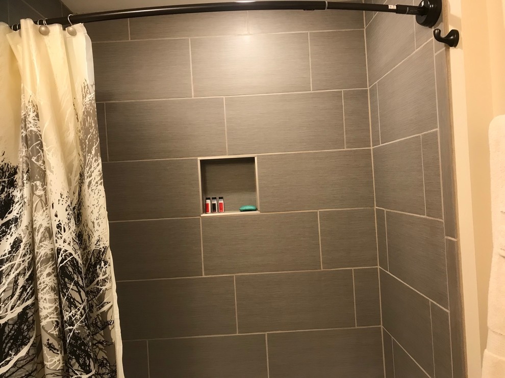 Finished Basement Bathroom with ceramic tile floor and tub