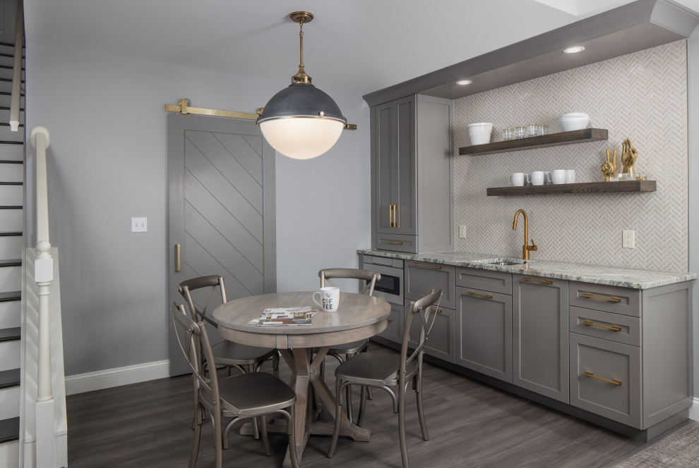Basement - mid-sized transitional underground laminate floor and gray floor basement idea with gray walls