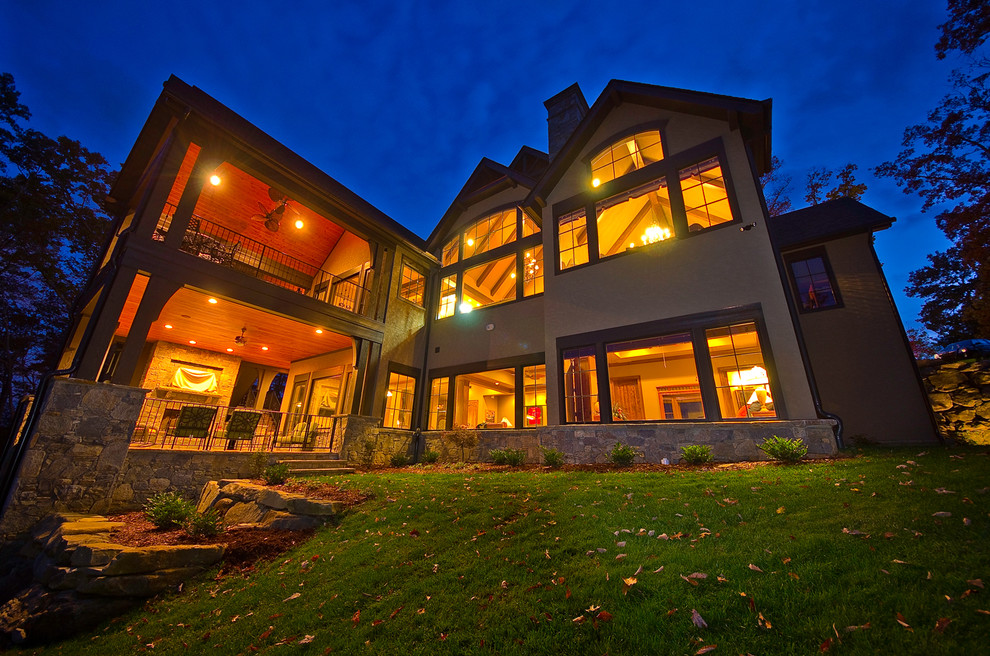 Large transitional beige two-story stucco gable roof photo