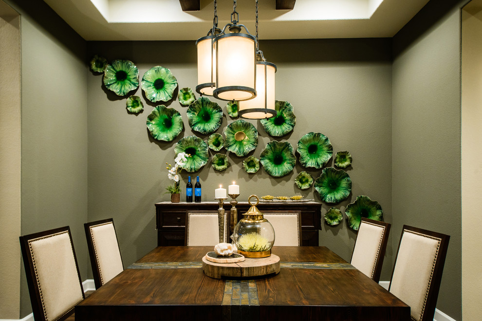 Inspiration for a contemporary separate dining room in Austin with green walls.