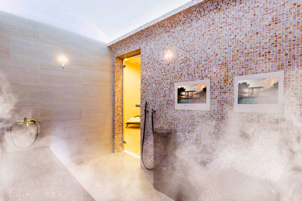 Photo of a mid-sized modern bathroom in Other with open cabinets, brown cabinets, a japanese tub, a shower/bathtub combo, a wall-mount toilet, yellow tile, ceramic tile, white walls, plywood floors, with a sauna, an integrated sink, glass benchtops, yellow floor and a hinged shower door.