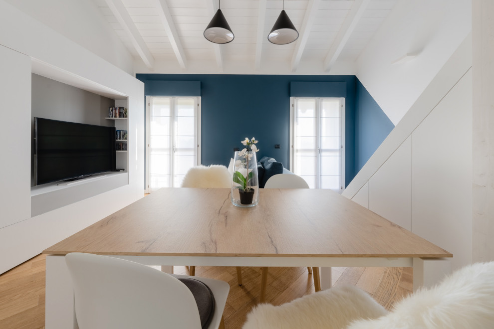 Design ideas for a small scandi dining room in Milan with multi-coloured walls, light hardwood flooring, beige floors and a wood ceiling.