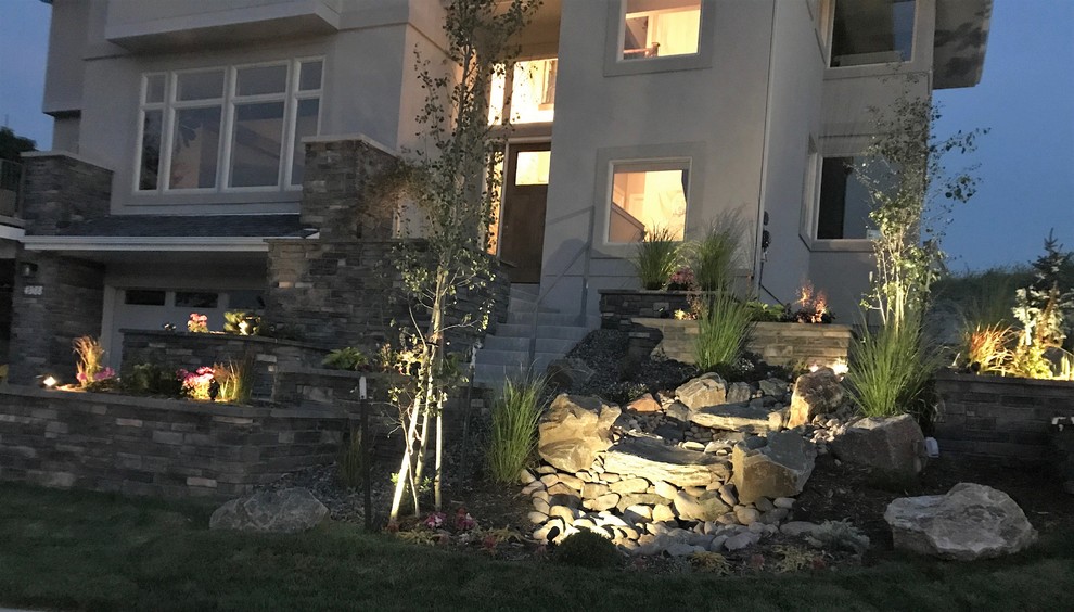 This is an example of a mid-sized contemporary front yard garden in Denver with with waterfall.