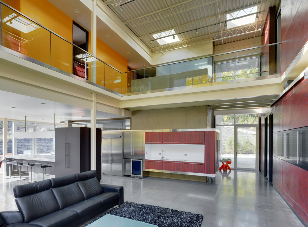 Industrial open concept living room in Cincinnati with concrete floors.