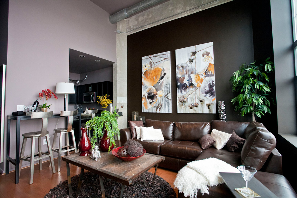 This is an example of a mid-sized contemporary living room in Baltimore with black walls.
