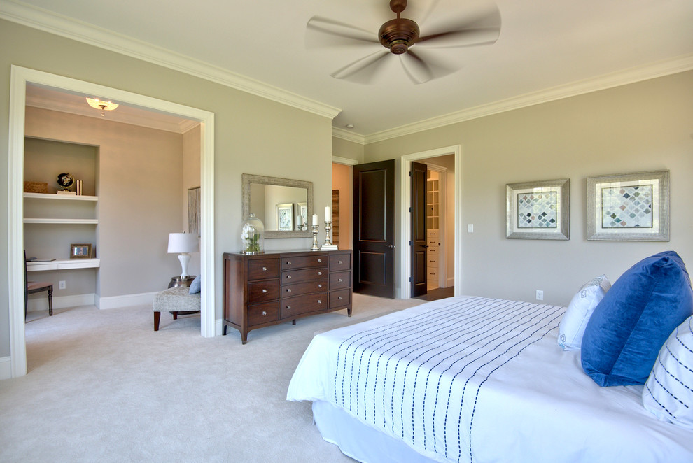 Design ideas for a large country master bedroom in Raleigh with beige walls, carpet and beige floor.