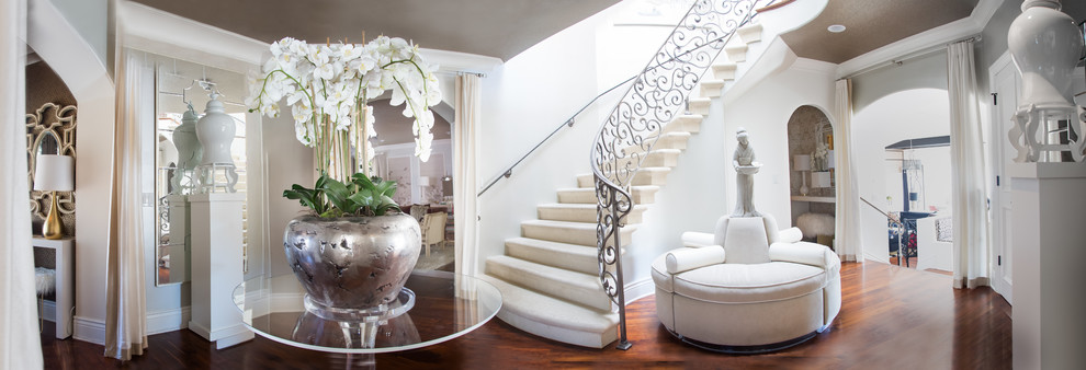 Inspiration for a mid-sized transitional medium tone wood floor and brown floor foyer remodel with white walls