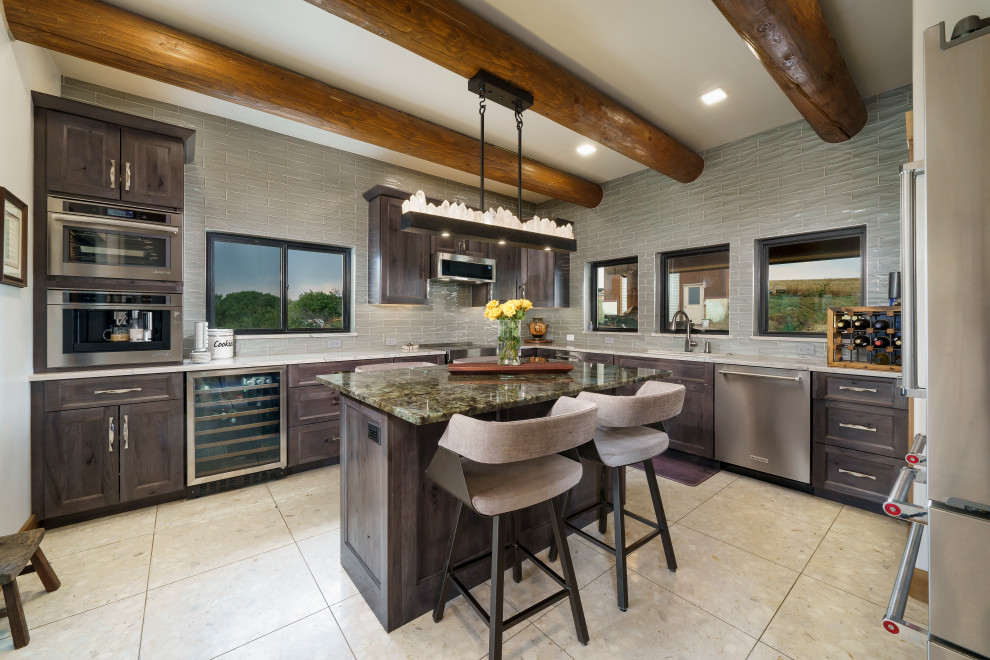 Inspiration for a mid-sized contemporary u-shaped separate kitchen in Denver with a single-bowl sink, shaker cabinets, grey cabinets, quartzite benchtops, grey splashback, glass tile splashback, stainless steel appliances, terrazzo floors, with island, white floor, multi-coloured benchtop and exposed beam.