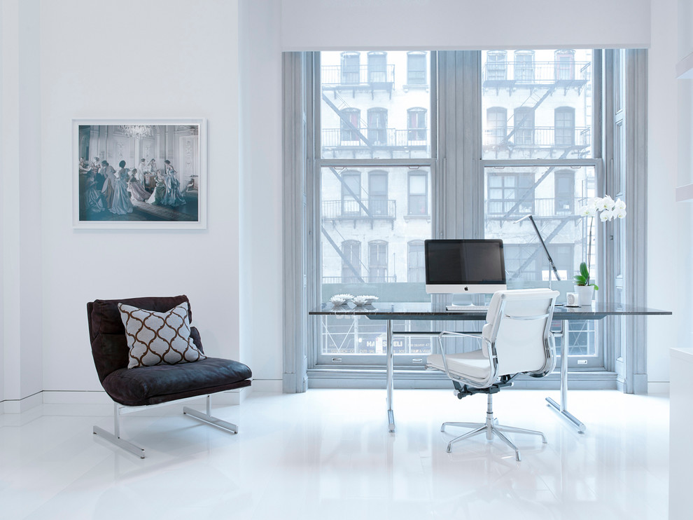 Example of a danish freestanding desk home office design in New York
