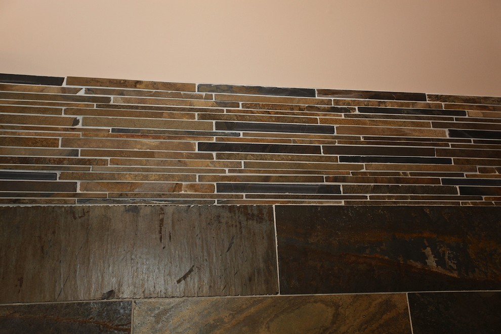 Large mountain style master slate tile brown floor home design photo in Indianapolis with brown cabinets, beige walls and an undermount sink