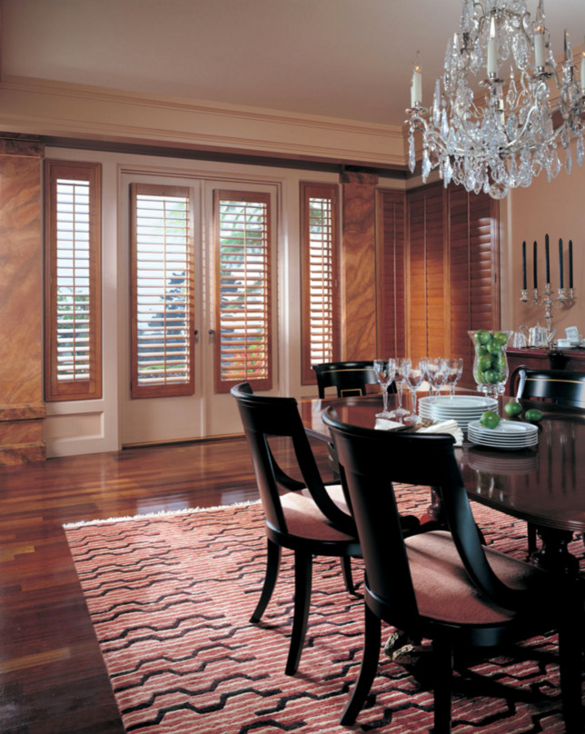Large transitional dark wood floor and brown floor enclosed dining room photo in Phoenix with beige walls and no fireplace