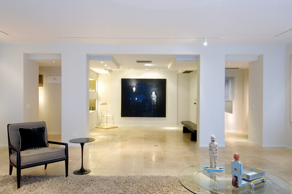 Photo of a mid-sized modern foyer in Hawaii with white walls, terrazzo floors, a single front door and a white front door.