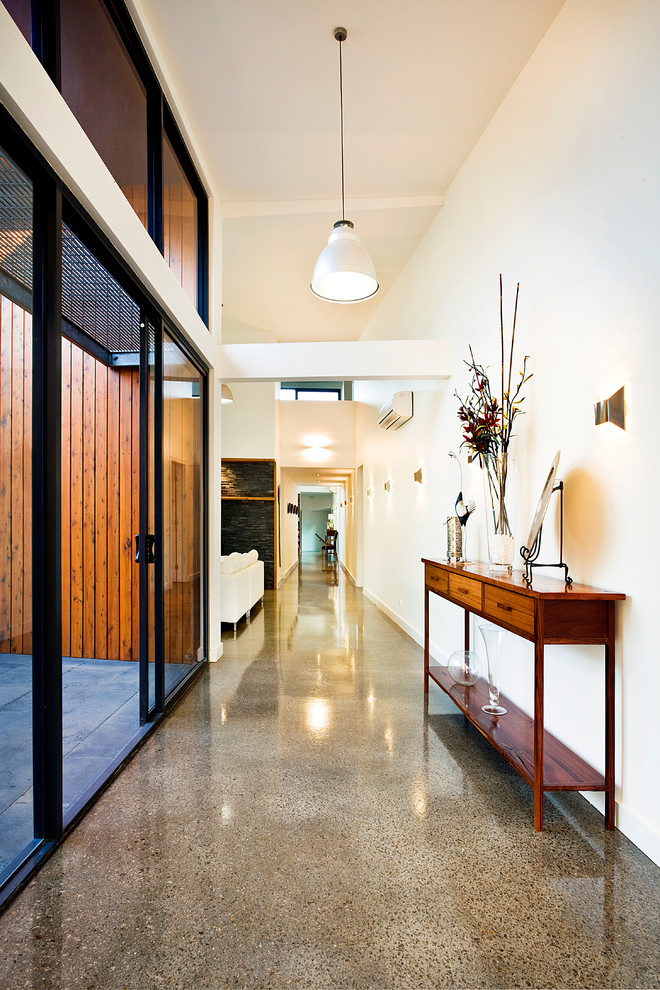 Contemporary hallway in Melbourne with white walls.