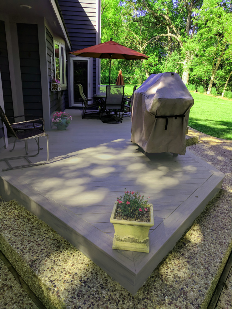 Inspiration for a mid-sized coastal backyard deck remodel with no cover
