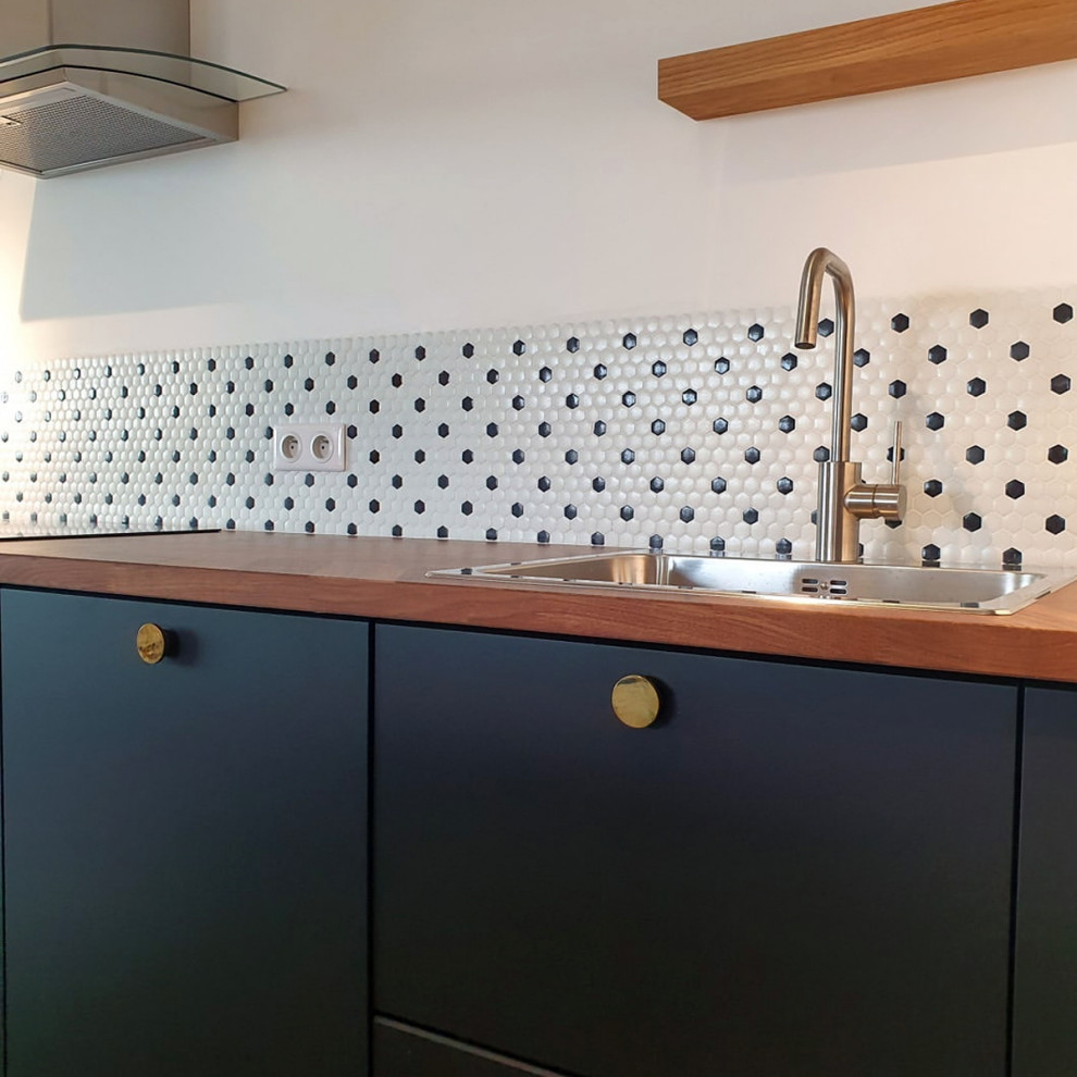 Mid-sized midcentury kitchen in Other with brown splashback and brown benchtop.