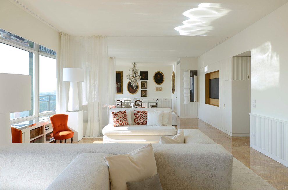 Photo of an expansive eclectic living room in Milan with white walls and marble floors.
