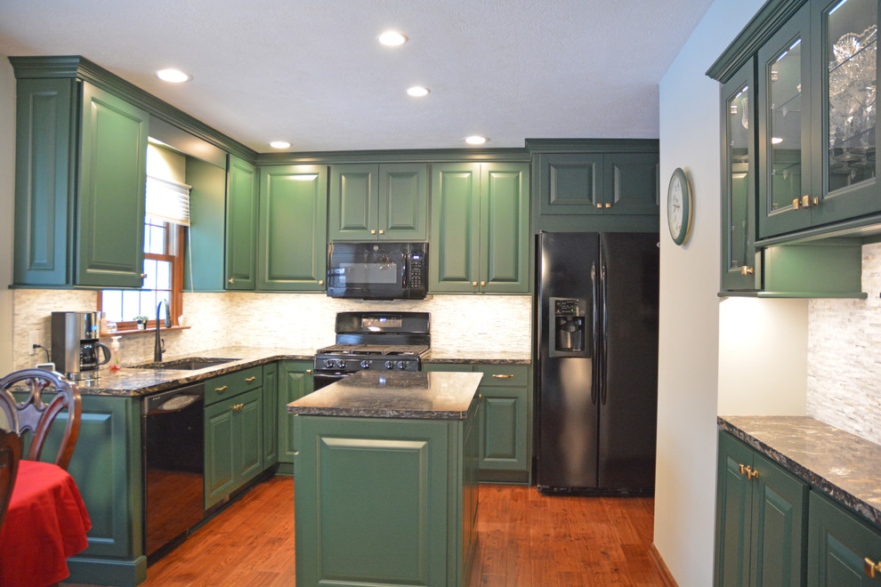 Small transitional l-shaped medium tone wood floor and brown floor eat-in kitchen photo with an undermount sink, raised-panel cabinets, green cabinets, quartz countertops, white backsplash, marble backsplash, black appliances, an island and multicolored countertops