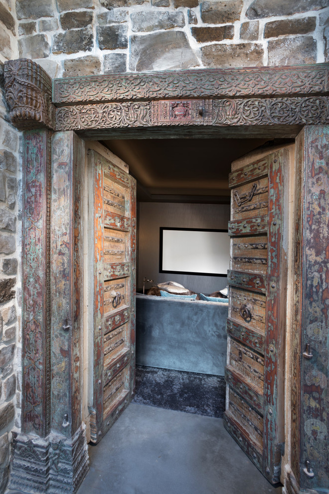 Mountain style concrete floor and gray floor double front door photo with a medium wood front door