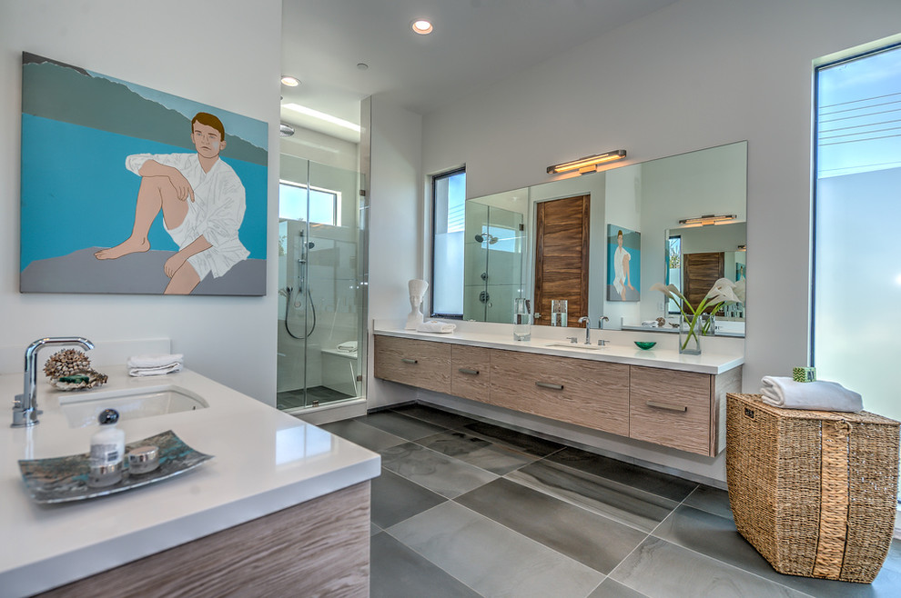 Large modern master wet room bathroom in San Francisco with flat-panel cabinets, medium wood cabinets, a drop-in tub, beige walls, porcelain floors and an undermount sink.