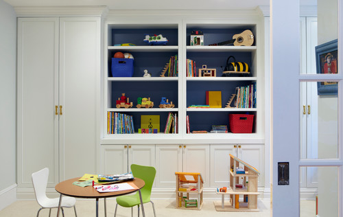 homeschool room or playroom with a table and chairs and shelves and cabinets for storage