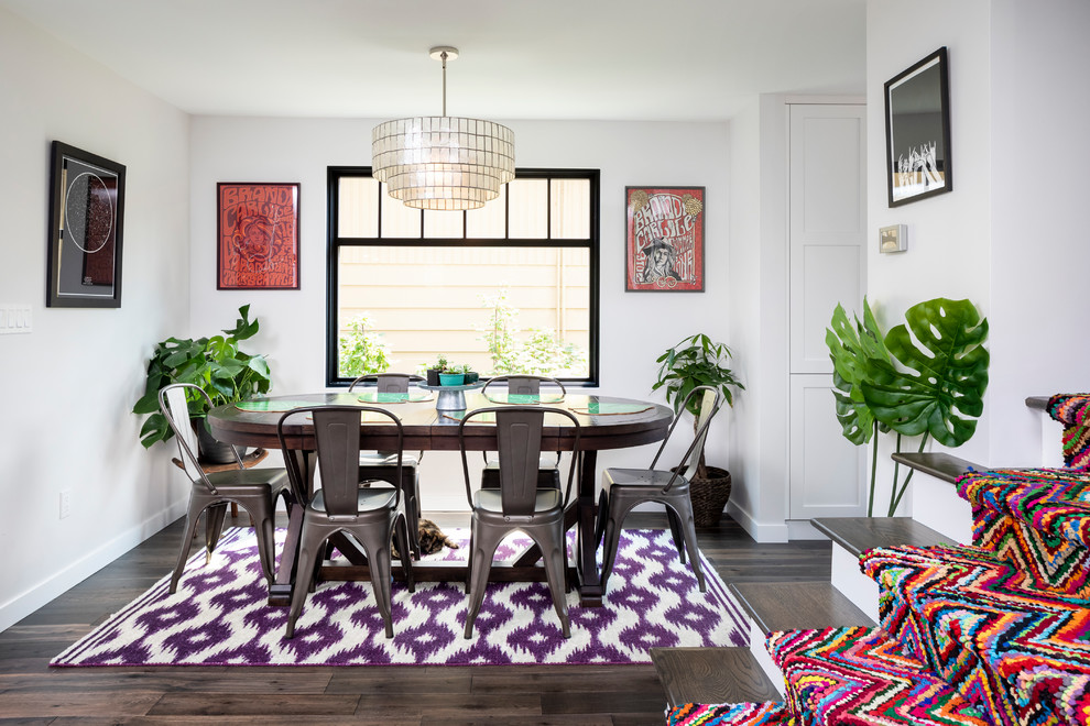 Small contemporary open plan dining in Seattle with white walls, dark hardwood floors, no fireplace and brown floor.