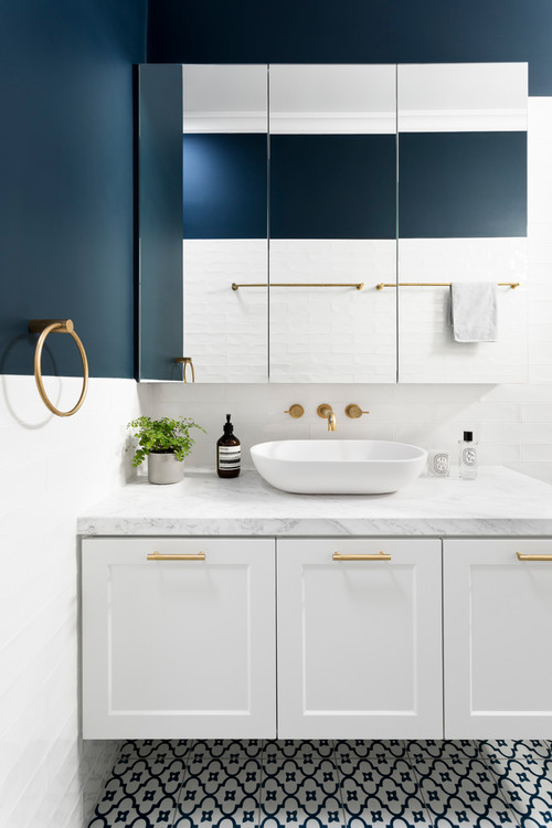 Contemporary Harmony: Blue Walls and Gold Fixtures Unite for White Bathroom with Gold Fixtures