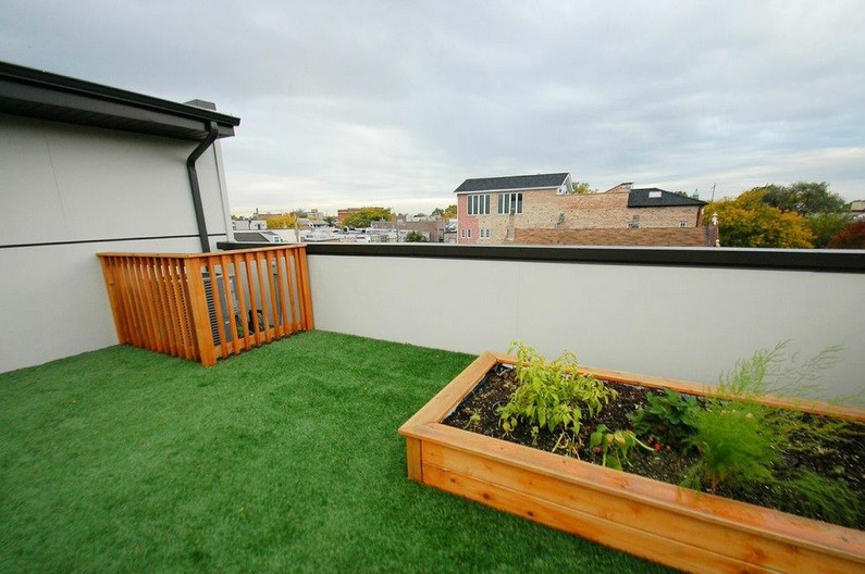 Mid-sized minimalist rooftop deck photo in Chicago with no cover