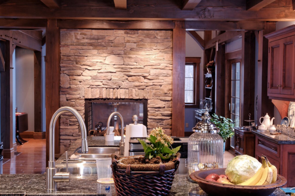 Example of a large mountain style galley dark wood floor open concept kitchen design in Boston with an undermount sink, shaker cabinets, white cabinets, granite countertops, stainless steel appliances and an island