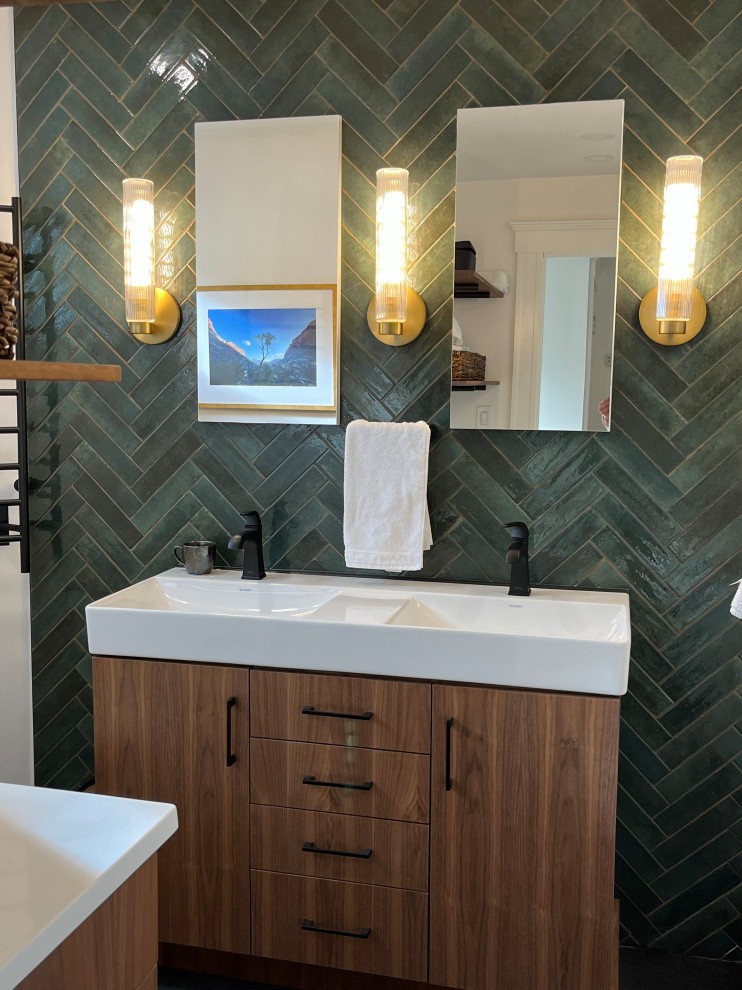 This is an example of a mid-sized midcentury master bathroom in Boston with flat-panel cabinets, dark wood cabinets, an alcove tub, a shower/bathtub combo, a two-piece toilet, green tile, ceramic tile, white walls, porcelain floors, a console sink, solid surface benchtops, grey floor, a sliding shower screen, a double vanity and a freestanding vanity.