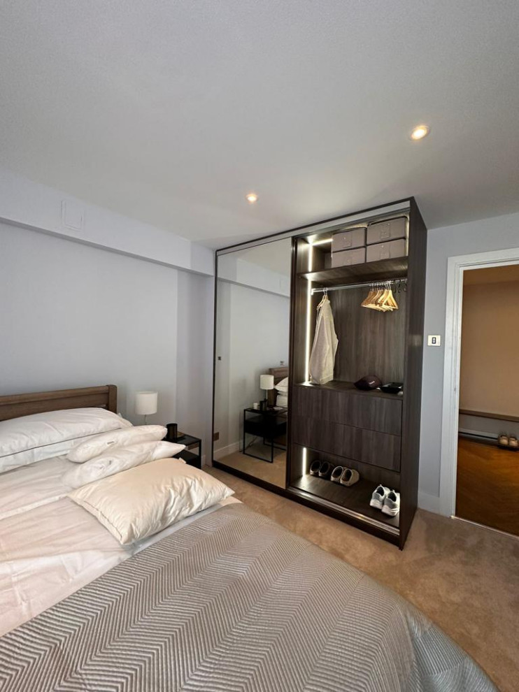 This is an example of a large contemporary bedroom in London.