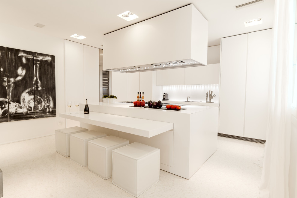 Inspiration for a contemporary galley kitchen in Baltimore with flat-panel cabinets, white cabinets, white splashback and with island.