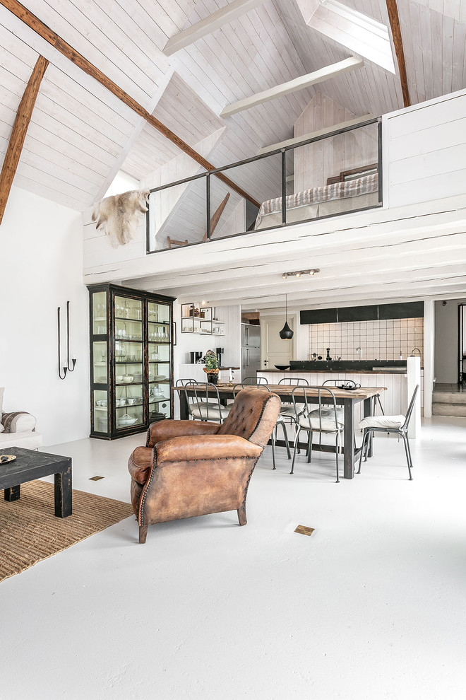 This is an example of a large country loft-style living room in Malmo with white walls, no fireplace and white floor.