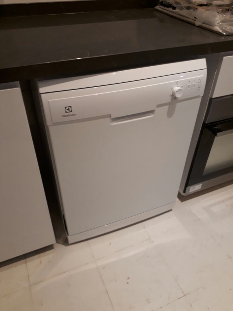 Freestanding dishwasher in kitchen cabinet
