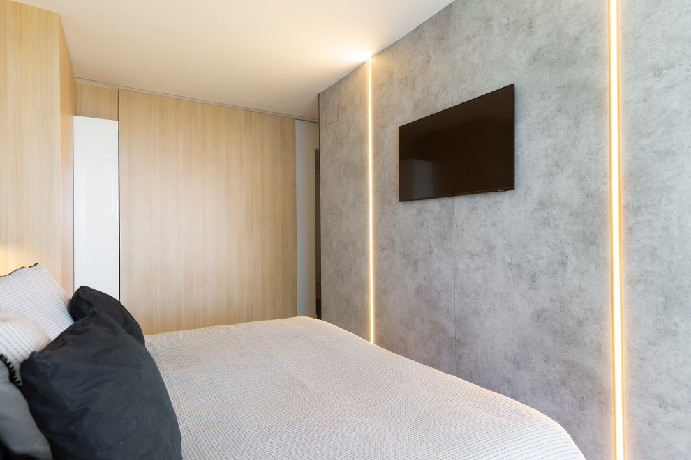 Photo of a large modern master and grey and black bedroom in Other with grey walls, porcelain flooring, beige floors and panelled walls.