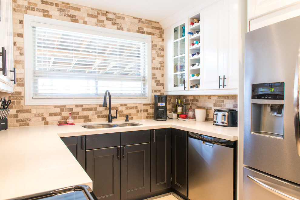 Eat-in kitchen - mid-sized transitional u-shaped ceramic tile eat-in kitchen idea in Toronto with an undermount sink, shaker cabinets, black cabinets, quartz countertops, brown backsplash, stone tile backsplash, stainless steel appliances and a peninsula