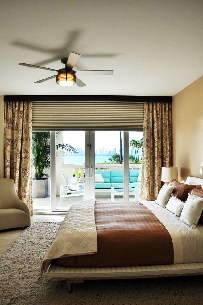 Contemporary bedroom in Miami with beige walls.