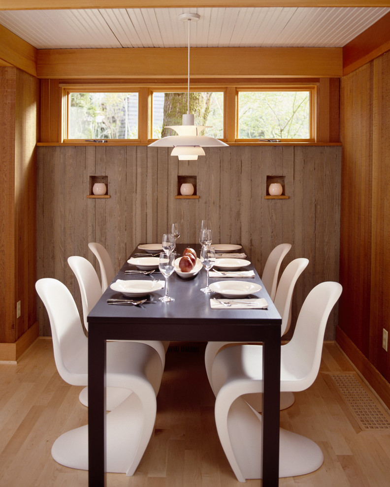 Design ideas for a contemporary dining room in Portland with medium hardwood floors.