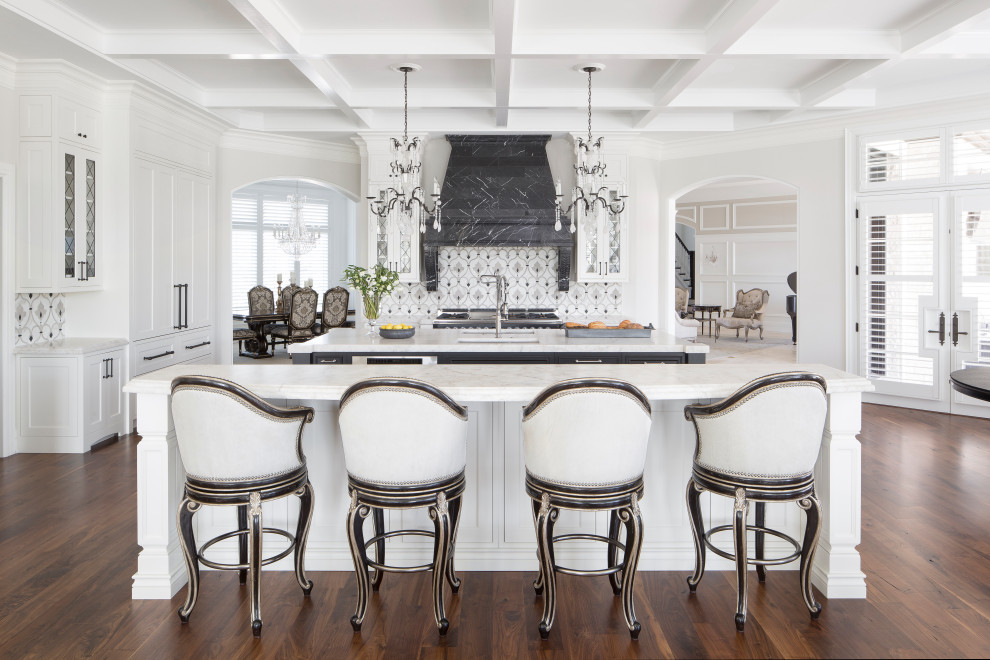 Inspiration for a separate kitchen in St Louis with an undermount sink, shaker cabinets, white cabinets, multi-coloured splashback, medium hardwood floors, multiple islands, white benchtop and coffered.
