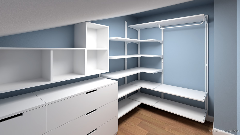 Mid-sized contemporary gender-neutral walk-in wardrobe in Milan with open cabinets and white cabinets.