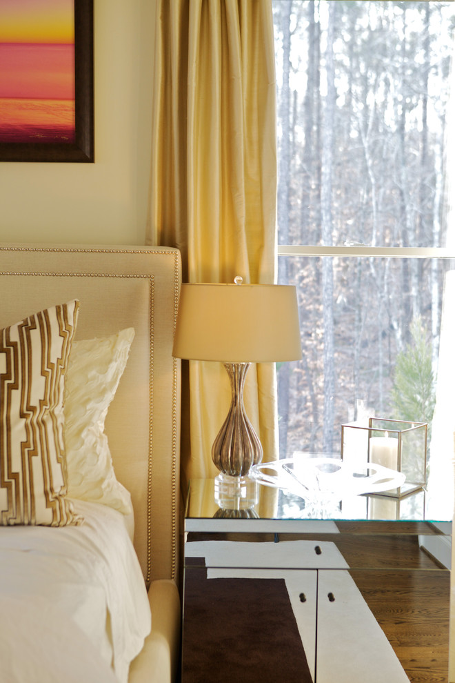 This is an example of a contemporary bedroom in Raleigh with beige walls.