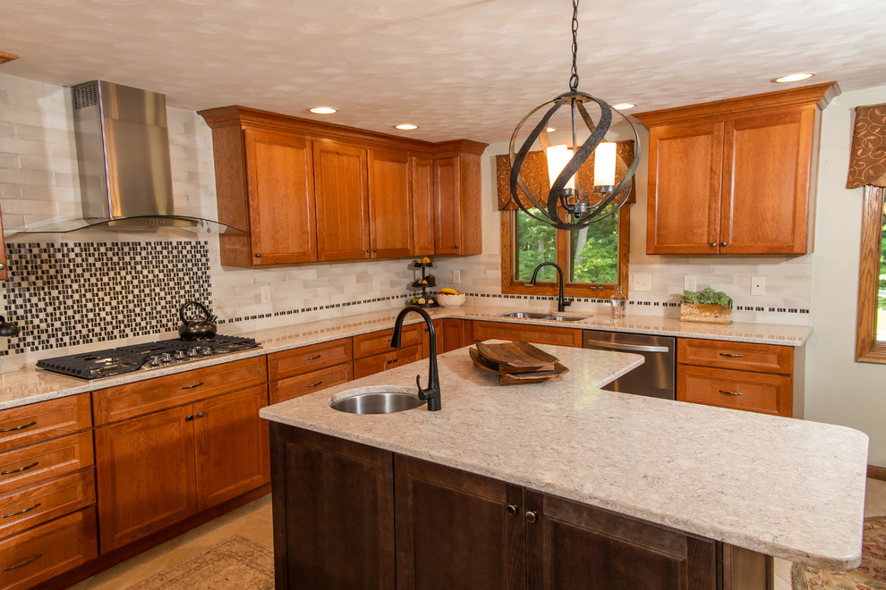 Example of a huge transitional l-shaped porcelain tile and white floor eat-in kitchen design with an undermount sink, flat-panel cabinets, medium tone wood cabinets, quartz countertops, white backsplash, ceramic backsplash, stainless steel appliances, two islands and white countertops