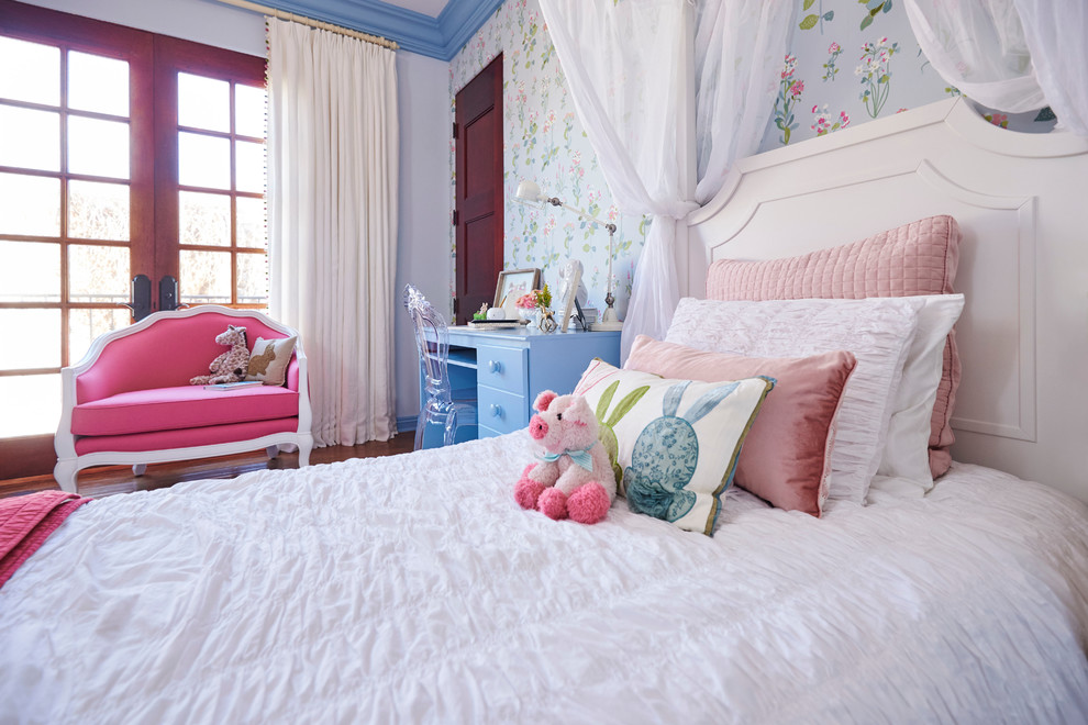 Inspiration for a large traditional kids' bedroom for kids 4-10 years old and girls in Los Angeles with blue walls and carpet.