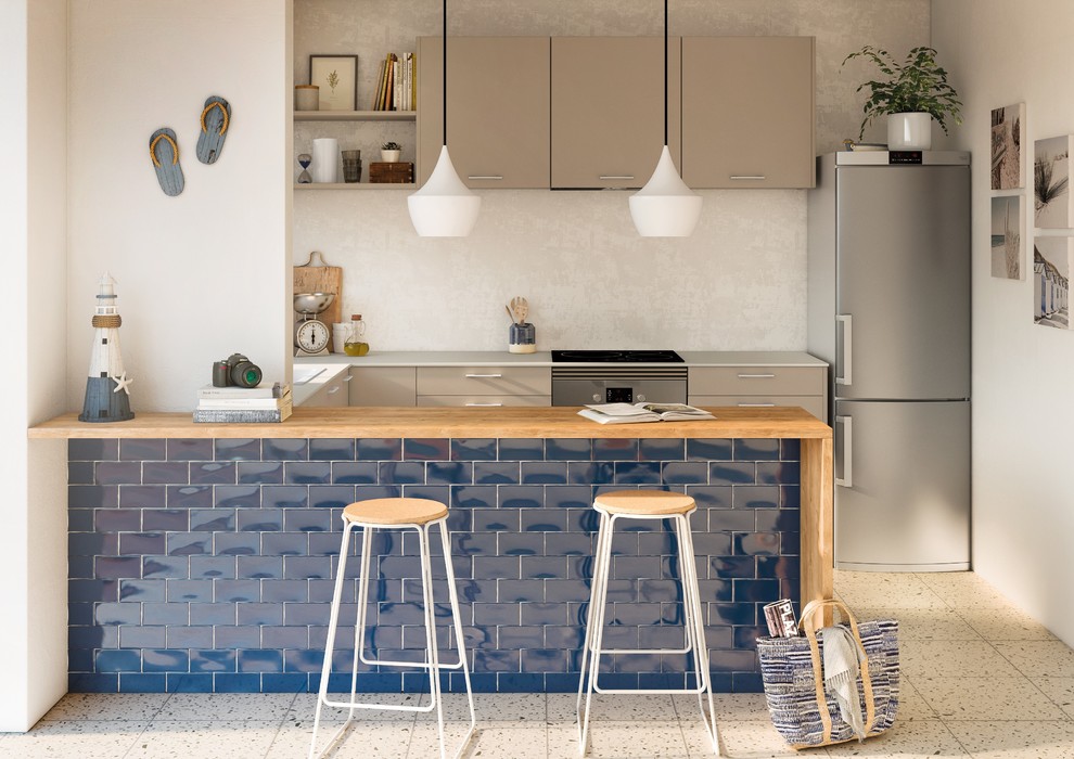 Photo of a mediterranean u-shaped eat-in kitchen in Barcelona with a drop-in sink, flat-panel cabinets, wood benchtops, ceramic floors, with island, white floor and brown benchtop.