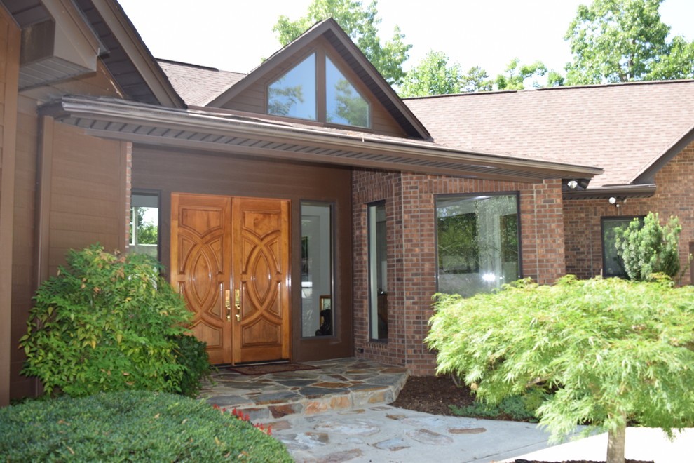 Mid-sized contemporary front door in Other with a double front door and a light wood front door.