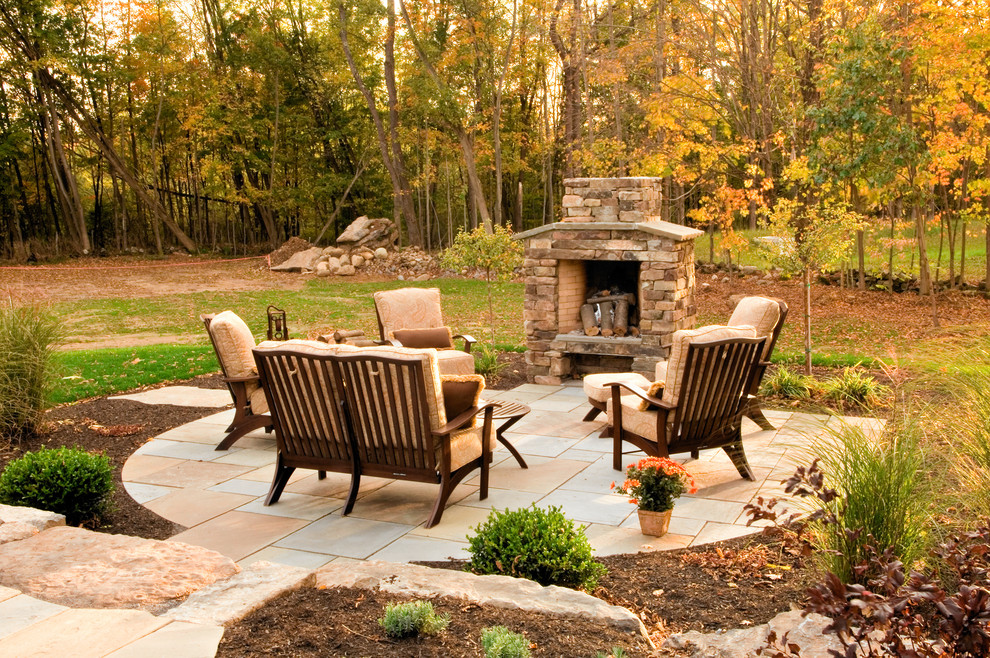 Traditional patio in Boston with a fire feature.