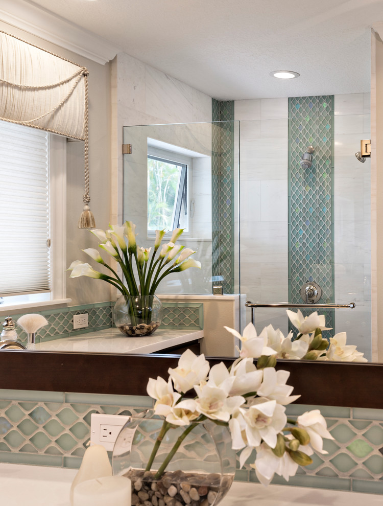 Design ideas for a mid-sized transitional master bathroom in Miami with flat-panel cabinets, dark wood cabinets, an alcove shower, blue tile, glass sheet wall, beige walls, porcelain floors, an undermount sink and engineered quartz benchtops.