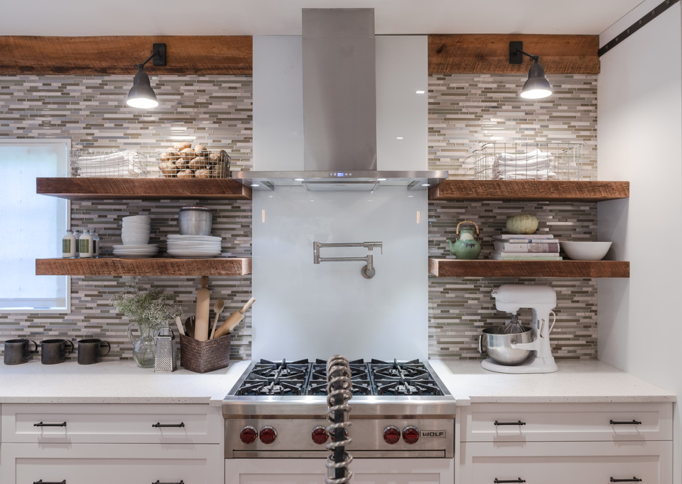 Inspiration for a large traditional l-shaped separate kitchen in Nashville with a farmhouse sink, open cabinets, white cabinets, quartz benchtops, multi-coloured splashback, matchstick tile splashback, stainless steel appliances, dark hardwood floors, with island and brown floor.