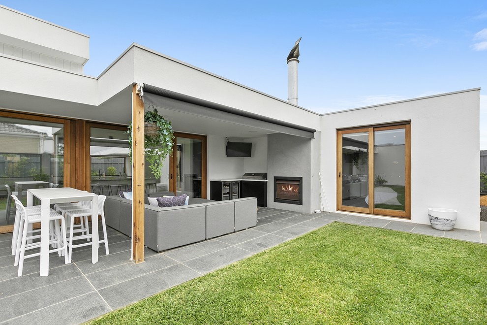 Inspiration for a large modern one-storey house exterior in Geelong with a flat roof.