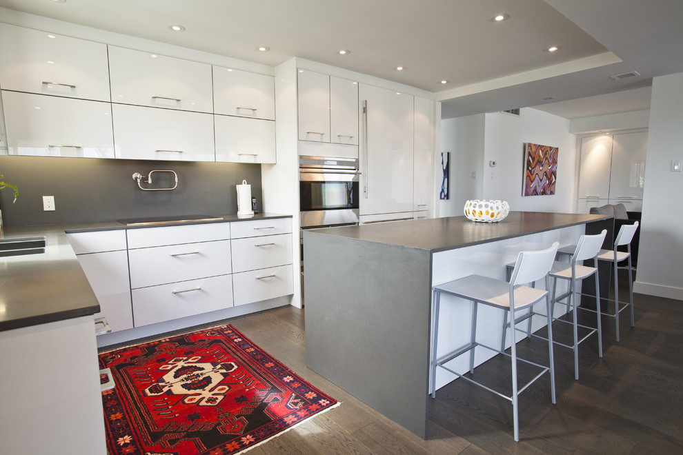 Photo of an eclectic kitchen in Toronto with quartz benchtops.