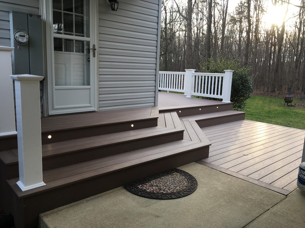 Deck - large traditional backyard deck idea with no cover